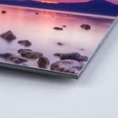 Shot of corner of photograph mounted to board with image of the ocean